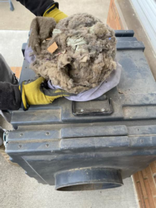 A large clump of lint and debris removed from an air duct during a cleaning service by X Calibur Enterprise Services LLC in Akron, OH.