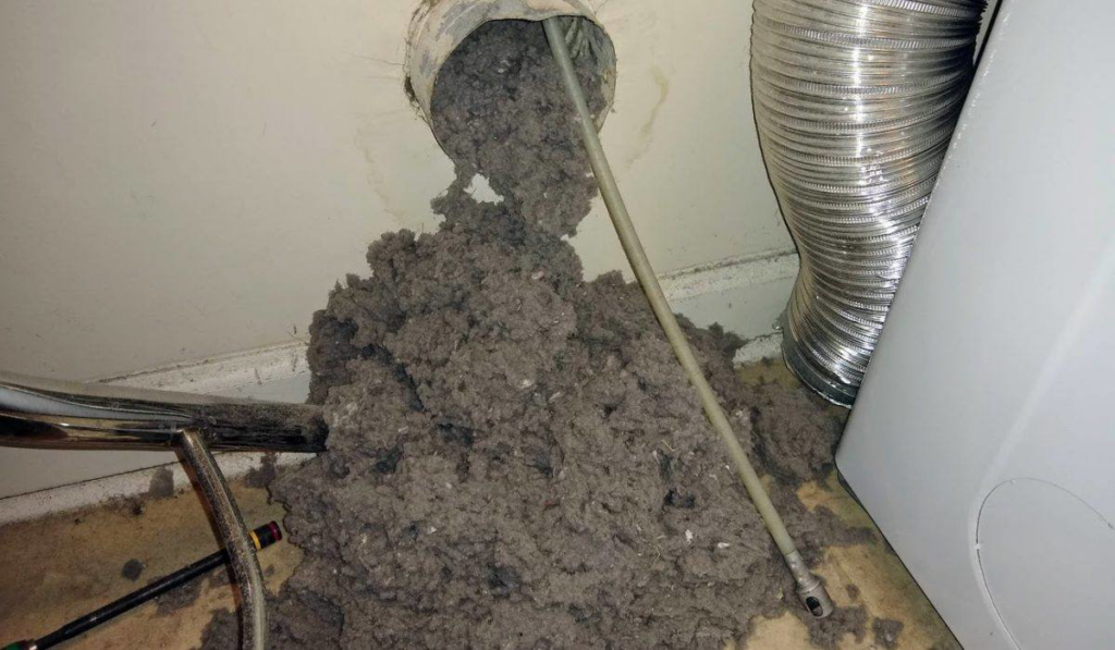 A large pile of lint and debris removed during a dryer vent cleaning service by Brady Air & Home Repair LLC in Asheboro, NC.