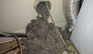 A large pile of lint and debris removed during a dryer vent cleaning service by Brady Air & Home Repair LLC in Asheboro, NC.