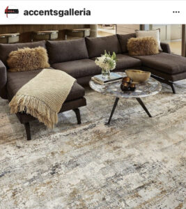 A stylish living room featuring an abstract patterned area rug from Accents Galleria in Kansas City, MO