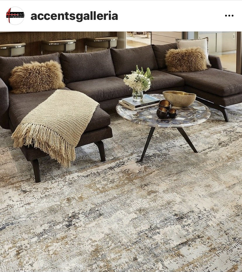 A stylish living room featuring an abstract patterned area rug from Accents Galleria in Kansas City, MO
