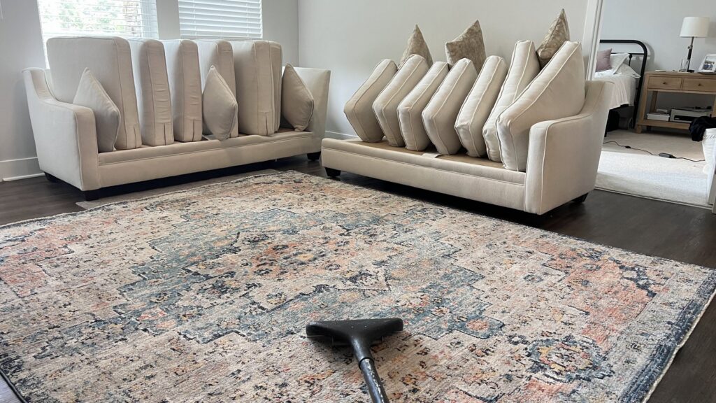 A living room area rug being professionally cleaned by Pronto And Carpet LLC in Charlotte, NC.