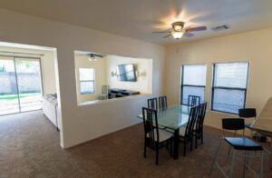 A spacious living room featuring a newly installed brown carpet by Arizona Flooring wholesale center in Chandler, AZ.