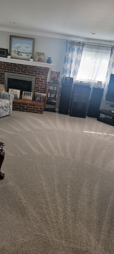 Freshly cleaned living room carpet with distinct vacuum lines by HM Cleaning Services in Annapolis, MD.