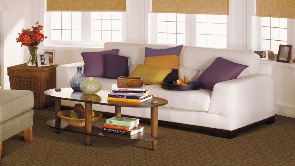 A comfortable living room with new wall-to-wall carpet installed by Carpet One Floor & Home Denver in Denver, CO.