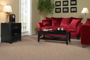 A cozy living room featuring a new light brown carpet installation by CR Flooring in Atlanta, GA