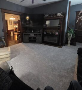 A living room with new light gray carpet installed by Flooring World Wide LLC in Plainwell, MI.