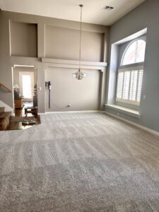 Spacious living room with new gray carpet installation by Floors by Aldaba LLC, a carpet contractor in North Las Vegas, NV.