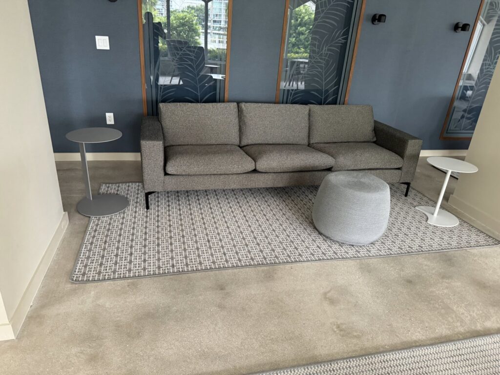 Completed carpet installation in a modern living room by Global Flooring Enterprise in Miami, FL.