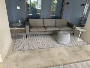 Completed carpet installation in a modern living room by Global Flooring Enterprise in Miami, FL.