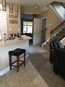 A living room featuring new carpet and a carpeted staircase, a project by Great Northern Flooring in Bensenville, IL.