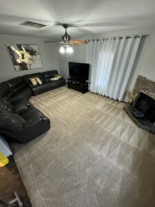 A living room carpet showing fresh cleaning lines around furniture, professionally cleaned by Carpet PRO Cleaner in Cary, NC.