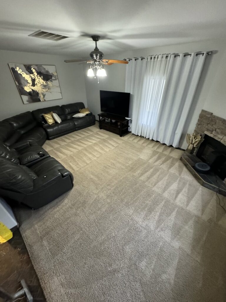 A living room carpet showing fresh cleaning lines around furniture, professionally cleaned by Carpet PRO Cleaner in Cary, NC.