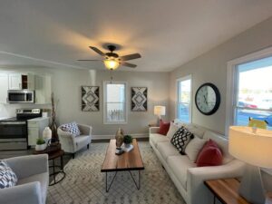 A finished living room featuring a ceiling fan and recessed lighting installed by Denny Power Solutions in Virginia Beach, VA