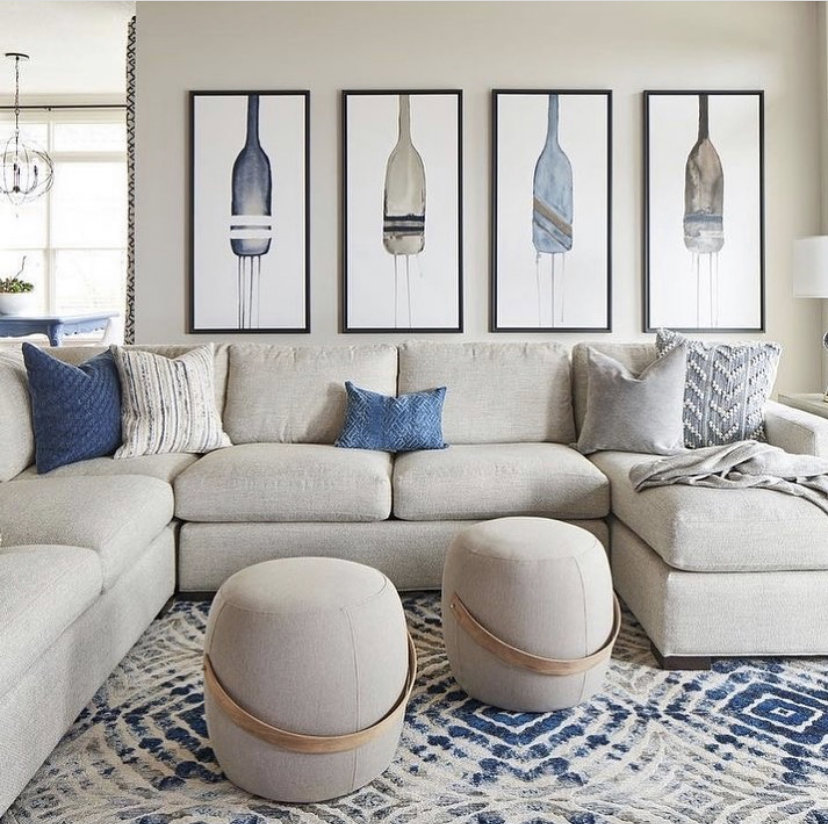 A cozy living room showcasing a large geometric patterned area rug from Accents Galleria in Kansas City, MO