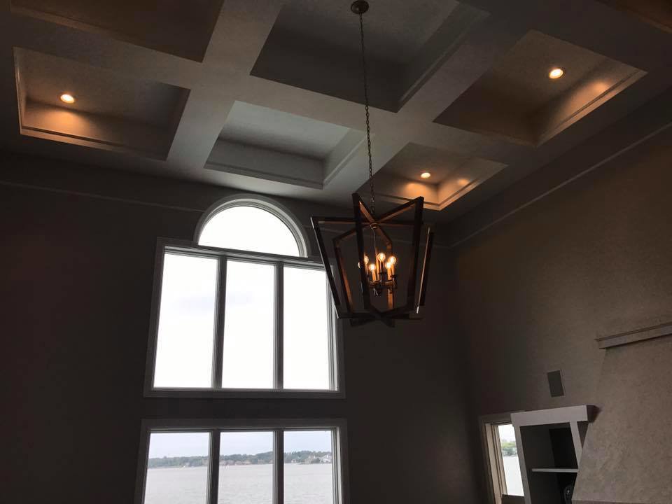 A modern geometric chandelier and recessed lighting installed in a living room by TGR Electric LLC in Carmel, IN.