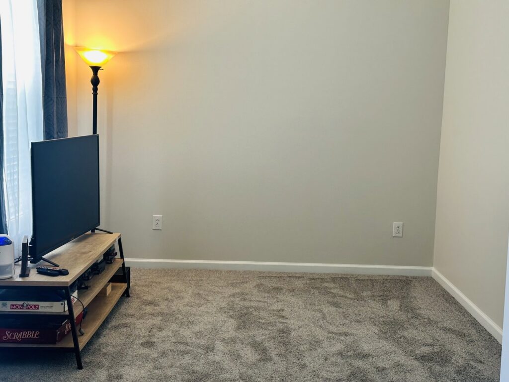A cozy living room with new gray carpet installed by Rocky Flooring in Greer, SC.