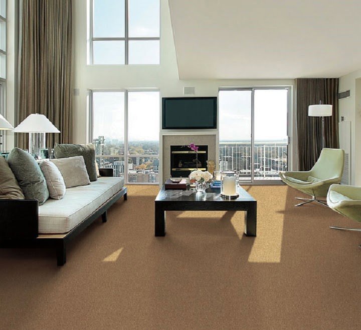 A spacious living room with elegant light brown carpet installed by Wall To Wall Carpet One Floor & Home in Eau Claire, WI