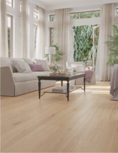 A bright living room featuring new light hardwood flooring installed by Carpet Planet LLC in Colorado Springs, CO.