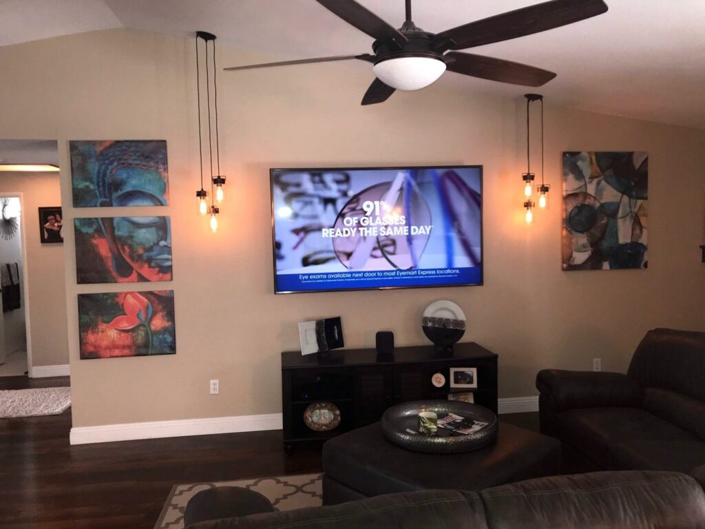 Living room with new ceiling fan and pendant lighting installed by Olectric in Reno, NV.