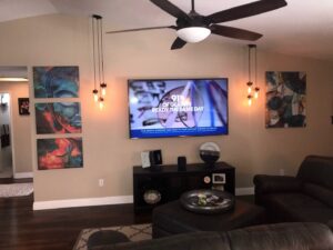 Living room with new ceiling fan and pendant lighting installed by Olectric in Reno, NV.