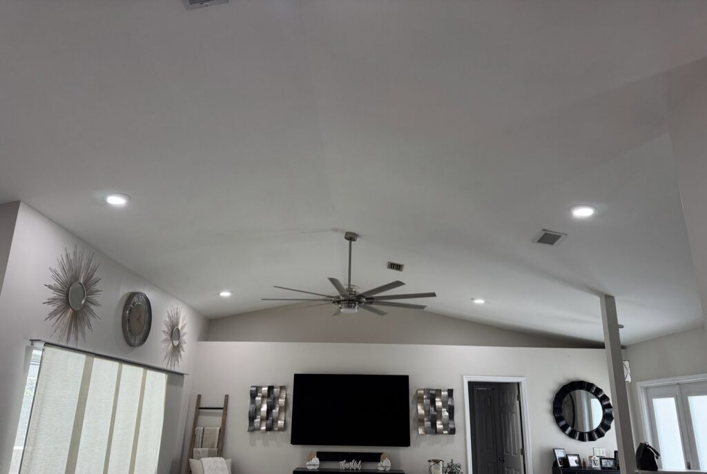 Living room with new recessed lighting and ceiling fan installation by Ryno Electric in Cape Coral, FL