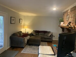 A cozy living room featuring bright recessed lighting installed by All Connected Electric LLC in Raleigh, NC.