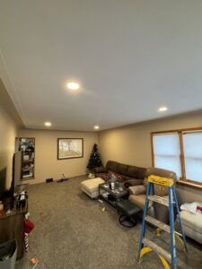 New recessed lighting installed in a living room ceiling, showing completed work by Schroeder Electric in Duluth, MN.