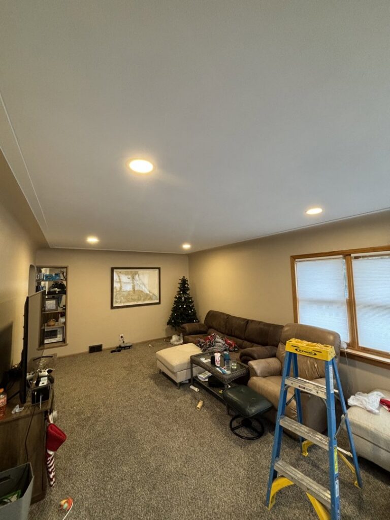 New recessed lighting installed in a living room ceiling, showing completed work by Schroeder Electric in Duluth, MN.