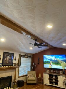 A living room featuring modern recessed lighting and a ceiling fan installed by Peak Electric in Mount Washington, KY.