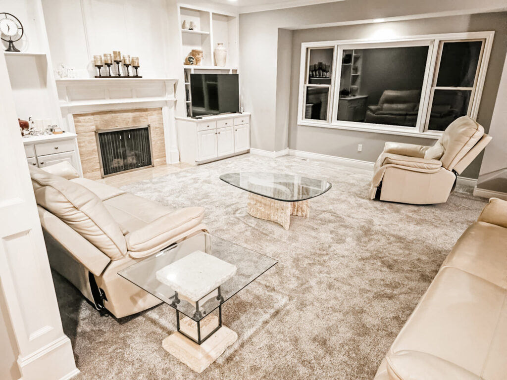 A cozy living room with a new light brown carpet installation by Absolute Floor Covering, Inc in Kentwood, MI.