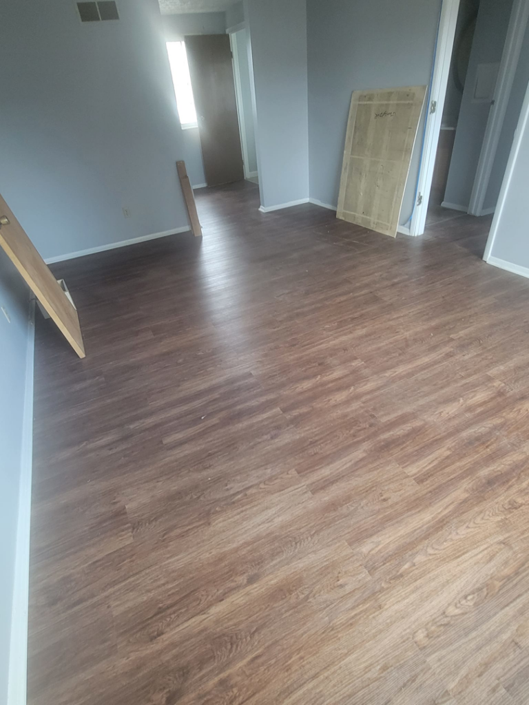 A spacious living room featuring new vinyl plank flooring installed by Harper's Floor's in Columbus, OH.