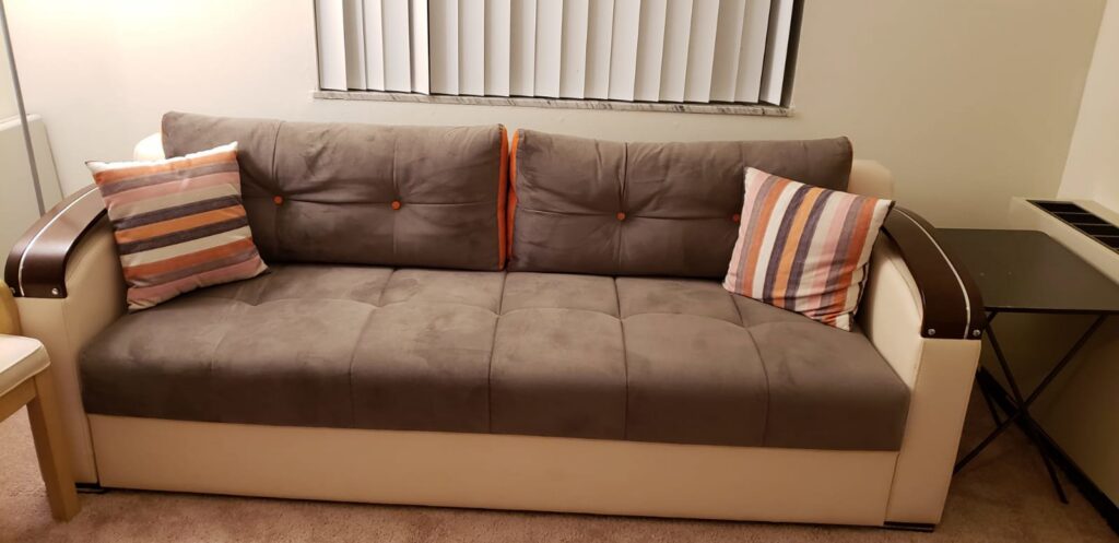 A cozy living room featuring a newly installed wall-to-wall carpet by Rug Gallery in Zionsville, IN.