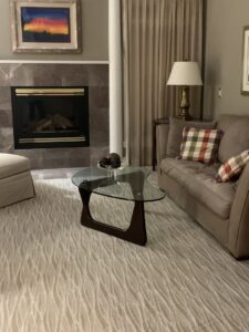 A living room featuring a newly installed wavy pattern carpet by Grade A Flooring in Bronx, NY.