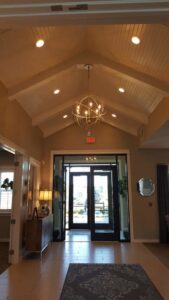 Lobby with recessed lighting and a chandelier, showcasing electrical installation by Safehouse Electric Company in Blue Springs, MO.