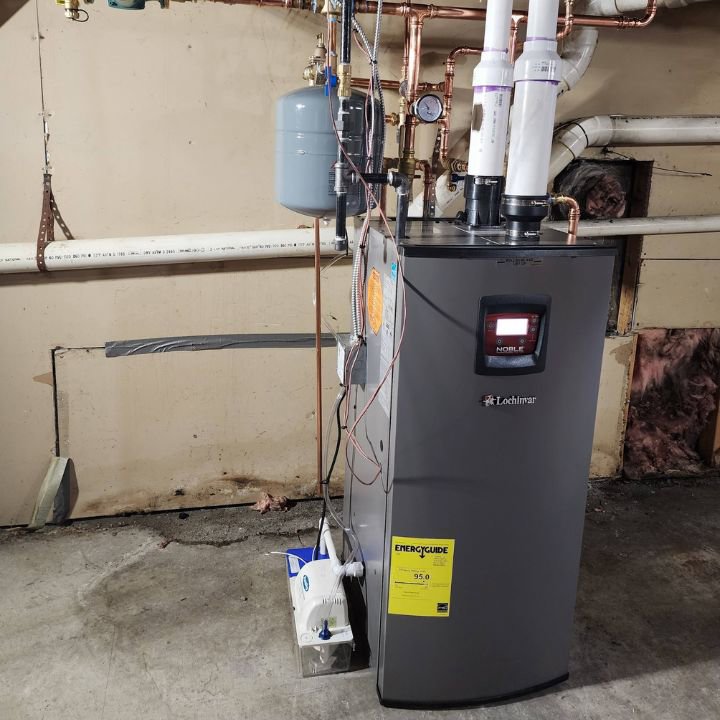 A Lochinvar water heater or boiler unit with piping installed by All The Way Heating & Cooling in Middleburgh, NY