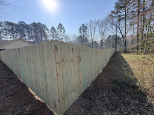 A long, curving wood privacy fence installation completed by Mayan Fence & Outdoor LLC in Phoenix, AZ.