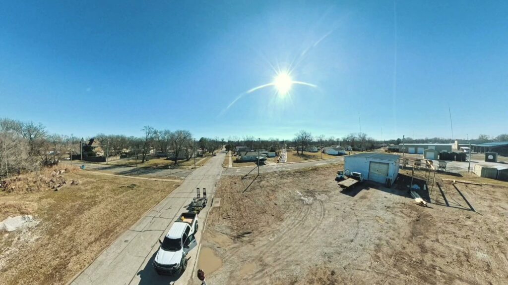 A long, newly installed wood fence in a residential setting by Fencing Company Of Omaha in Omaha, NE.