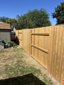 Long section of new wood privacy fence by Builders choice Fence, Deck & Patio Covers in Nampa, ID