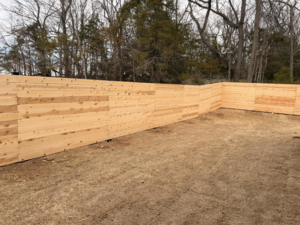 A long section of newly installed wood privacy fence by Old School Fence Co. in Springfield, MO.