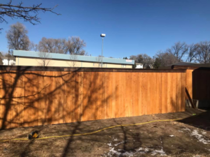 A long section of a newly installed wood privacy fence by Red Dirt Fencing and Woodwork, LLC in Fountain, CO.