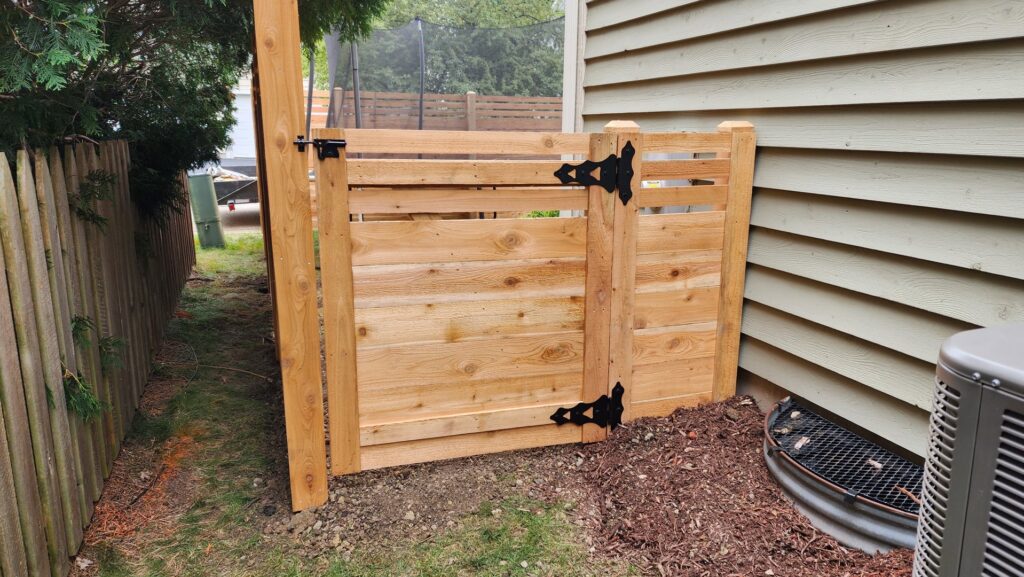 Long wood privacy fence installed in a spacious backyard by All Terrain Fence LLC in Waukegan, IL