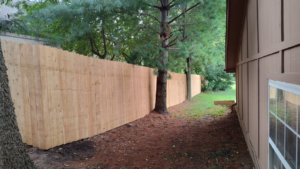 A long stretch of newly installed wood privacy fence by Lujan Fencing in Independence, MO.