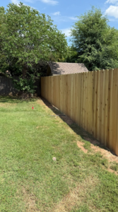 A long section of newly installed wood privacy fence by NC Fencing LLC in Wichita, KS.