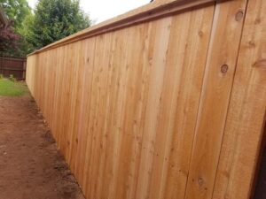 A long section of newly installed wood privacy fence by ProScape Outdoor Construction LLC in Norman, OK.