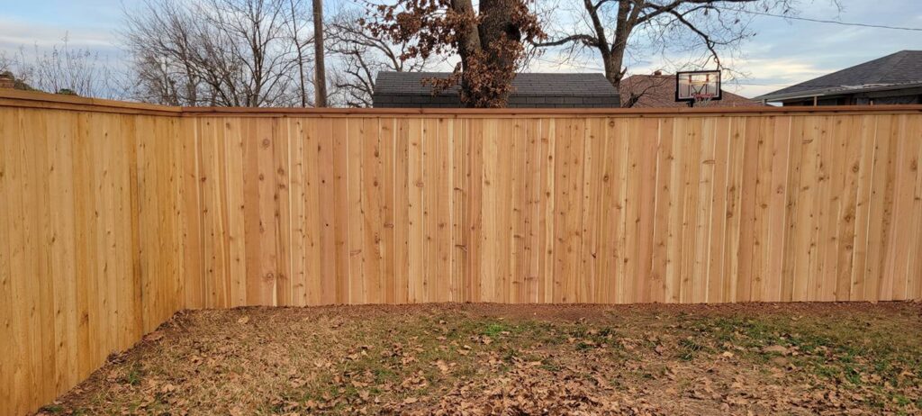 A long wood privacy fence installation completed by Veteran Fence Company LLC in Shawnee, OK.