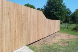 A long wooden privacy fence installed for a residential property by Nash Fence & Supplies Inc. in Lake Charles, LA.