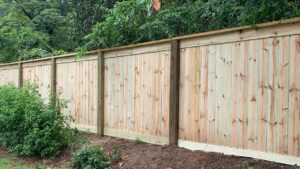 A long, newly installed wood privacy fence by United Fence Company in Johnston, RI.