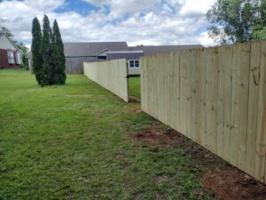 A long wood privacy fence with a gate installed by Fantastic Fences in Chattanooga, TN