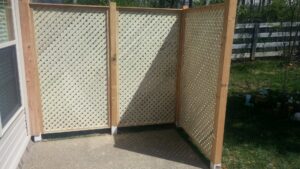 A long wooden privacy fence enclosing a residential backyard with a shed by Best Fence & Gate LLC in Louisville, KY.